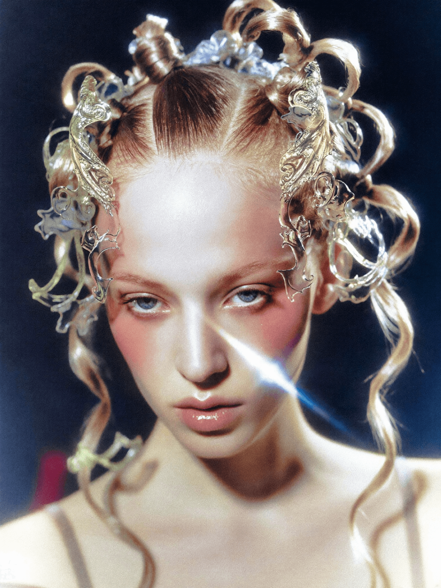 Close portrait with ornate gold and pearl hair sculpture, lens flare, film grain